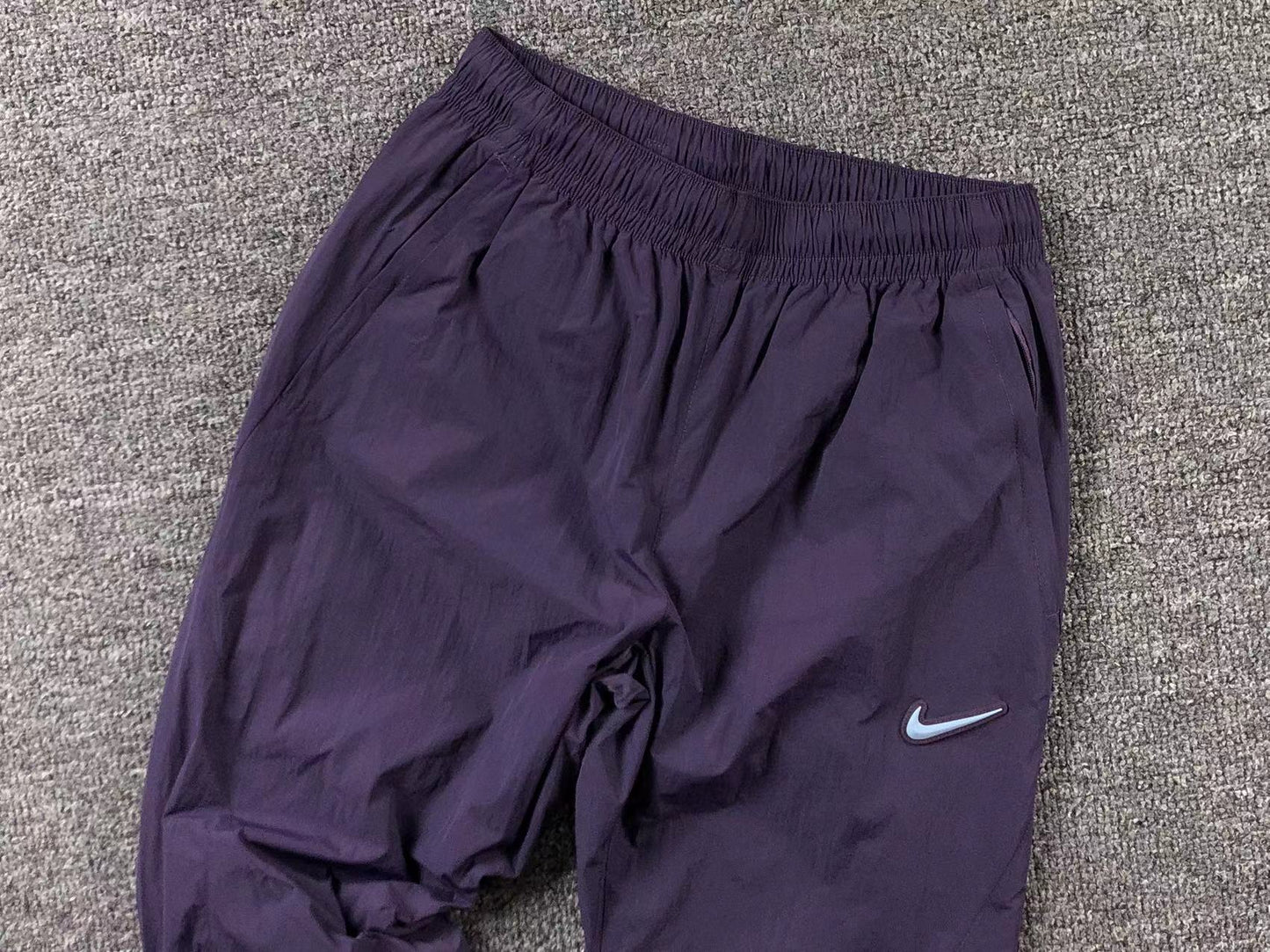 Conjunto Nike x NOCTA Woven "Roxo"