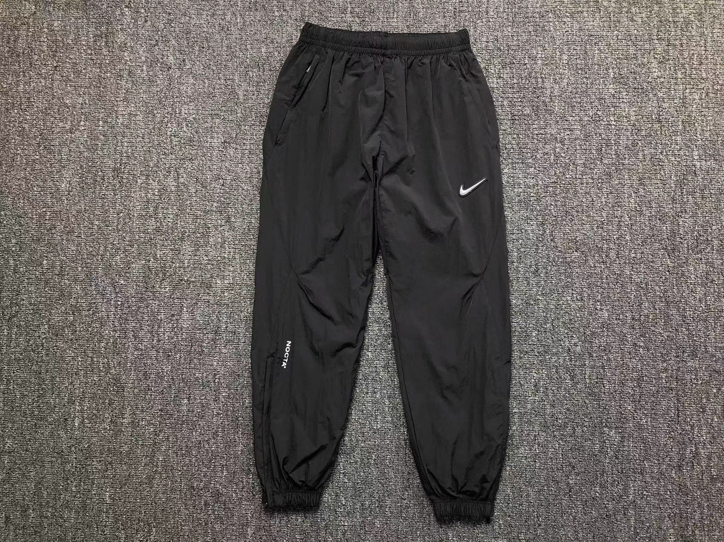 Conjunto Nike x NOCTA Woven "Preto e Cinza"