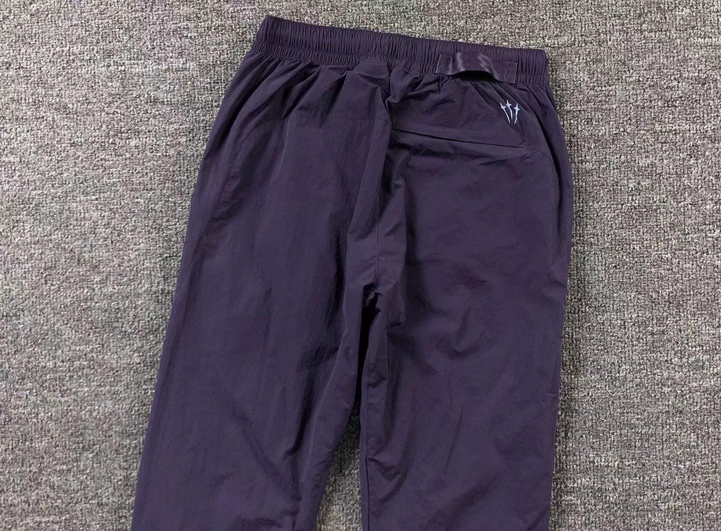 Conjunto Nike x NOCTA Woven "Roxo"