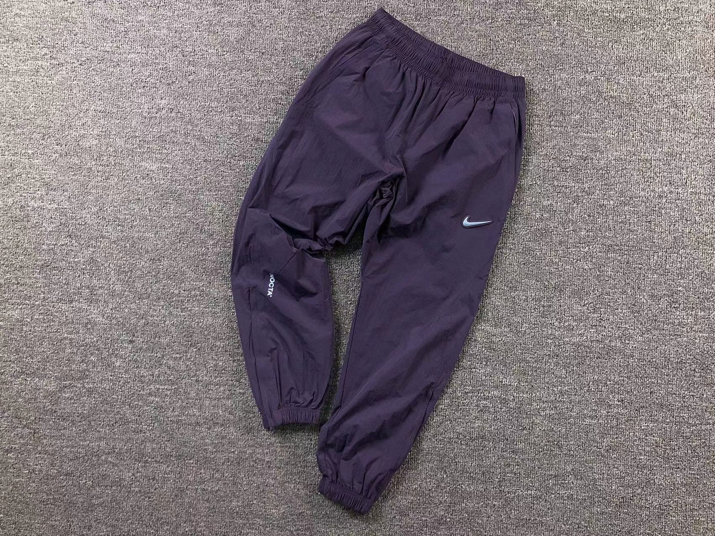 Conjunto Nike x NOCTA Woven "Roxo"