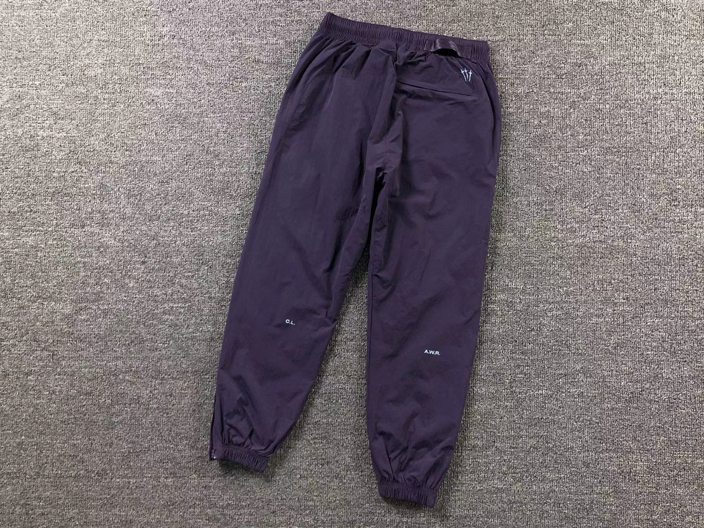 Conjunto Nike x NOCTA Woven "Roxo"