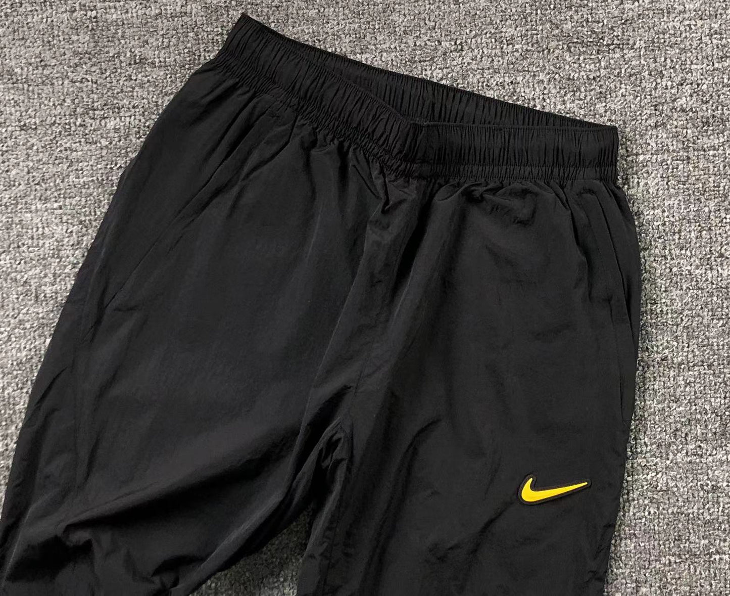 Conjunto Nike x NOCTA Woven "Amarelo e Preto"