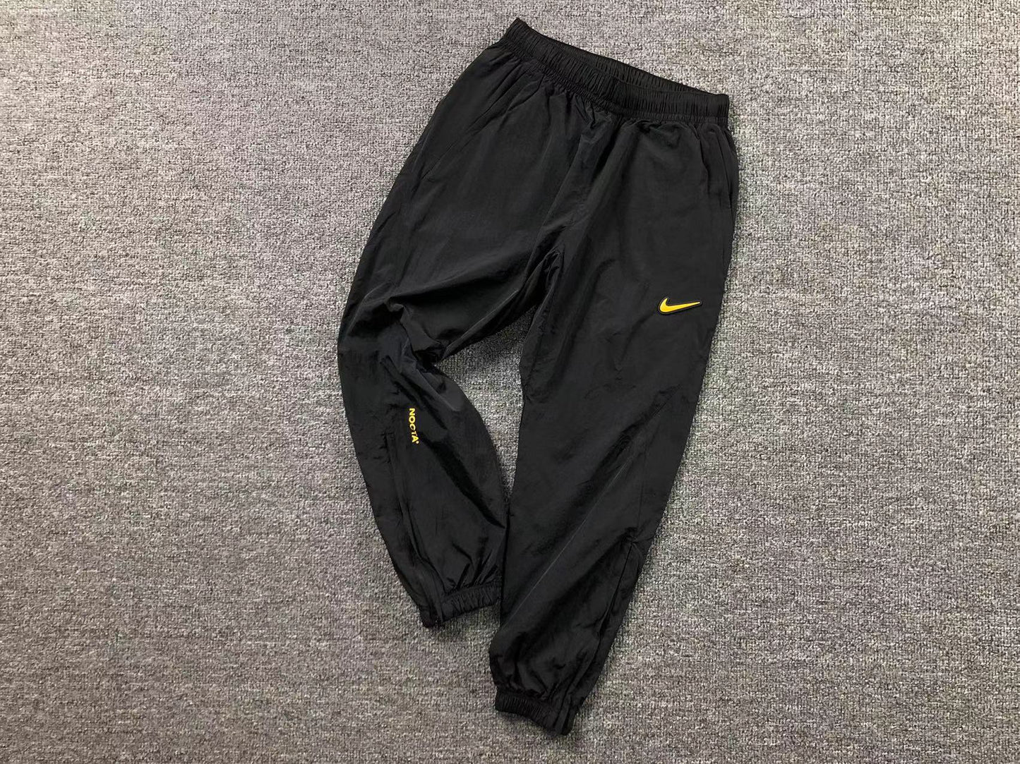 Conjunto Nike x NOCTA Woven "Amarelo e Preto"