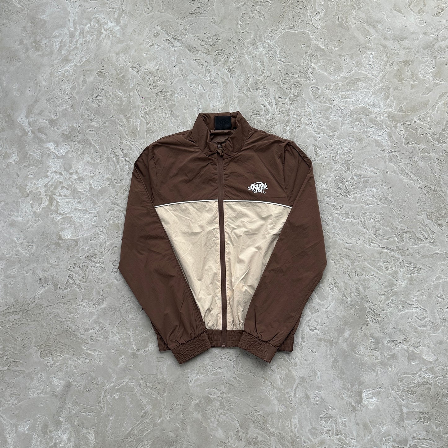 Conjunto Corta Vento SYNA World Marrom