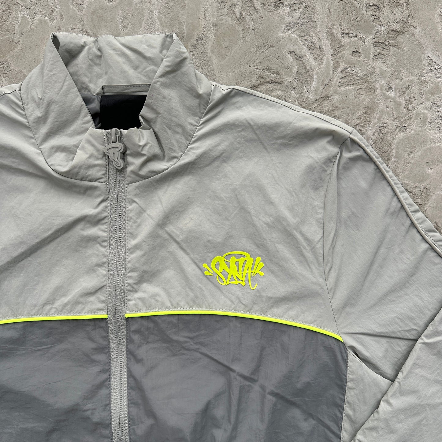 Conjunto Corta Vento SYNA World Cinza e Verde
