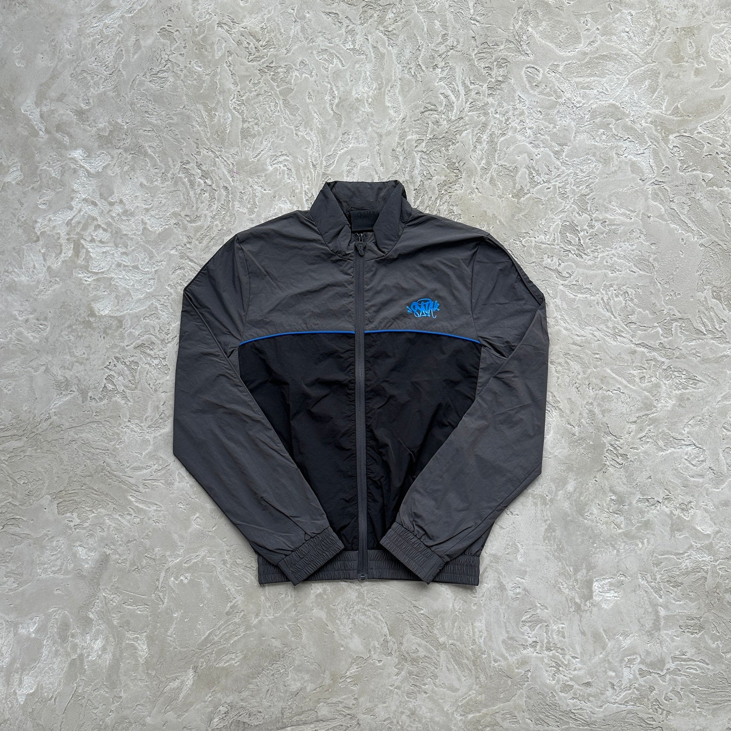 Conjunto Corta Vento SYNA World Preto e Azul