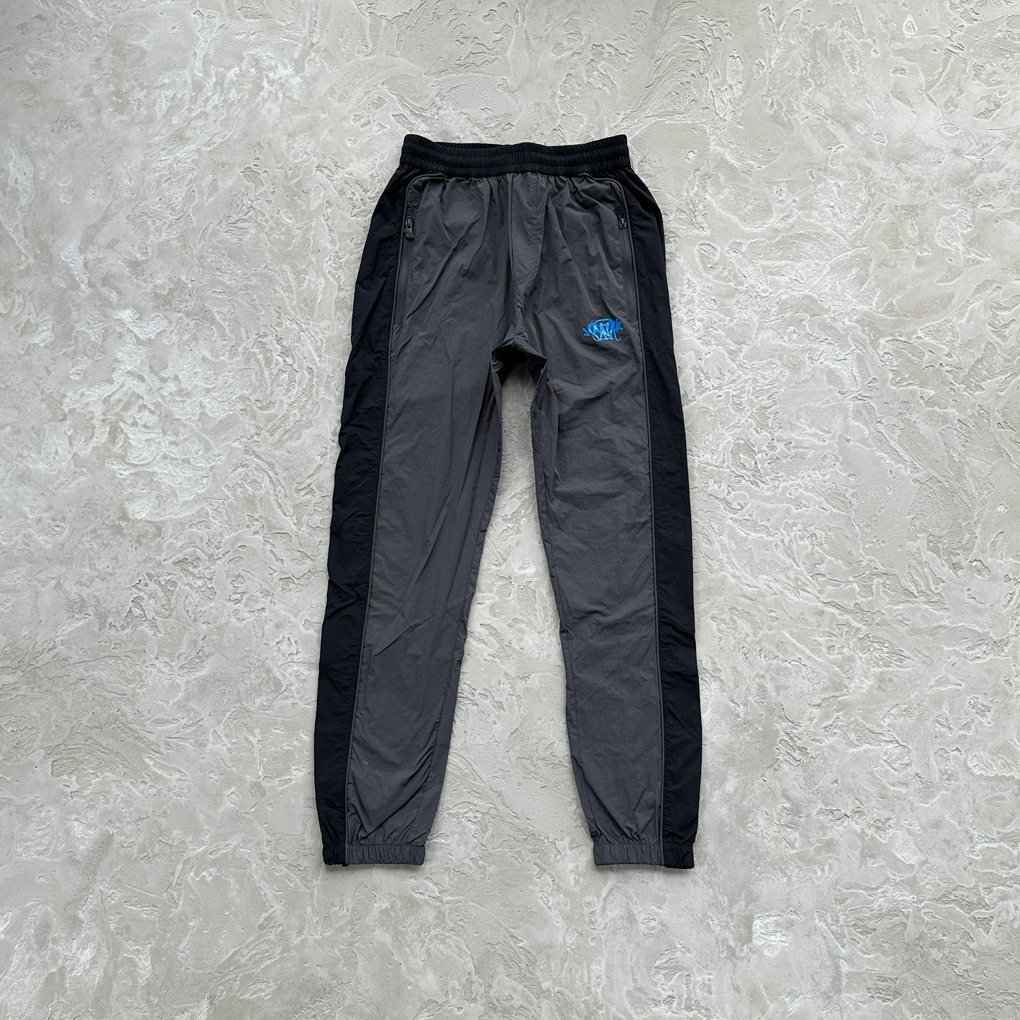Conjunto Corta Vento SYNA World Preto e Azul