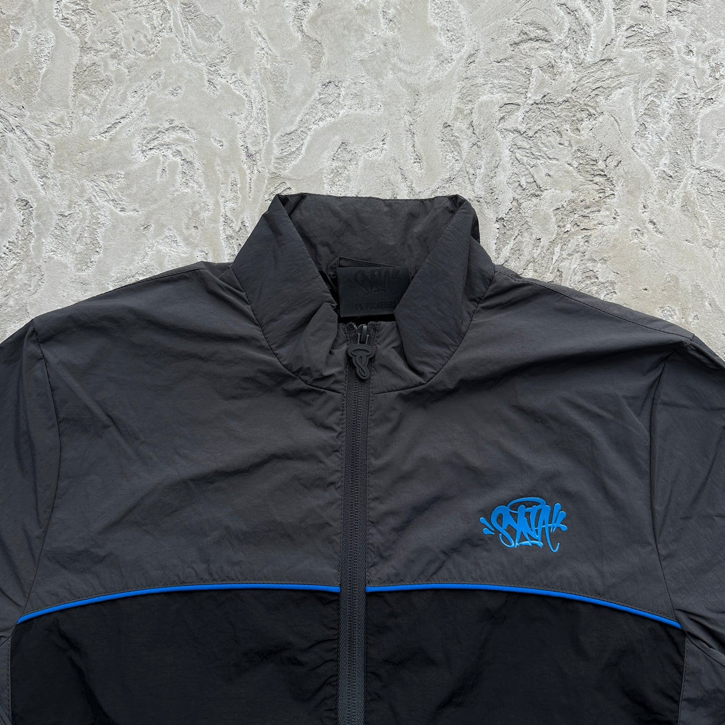 Conjunto Corta Vento SYNA World Preto e Azul