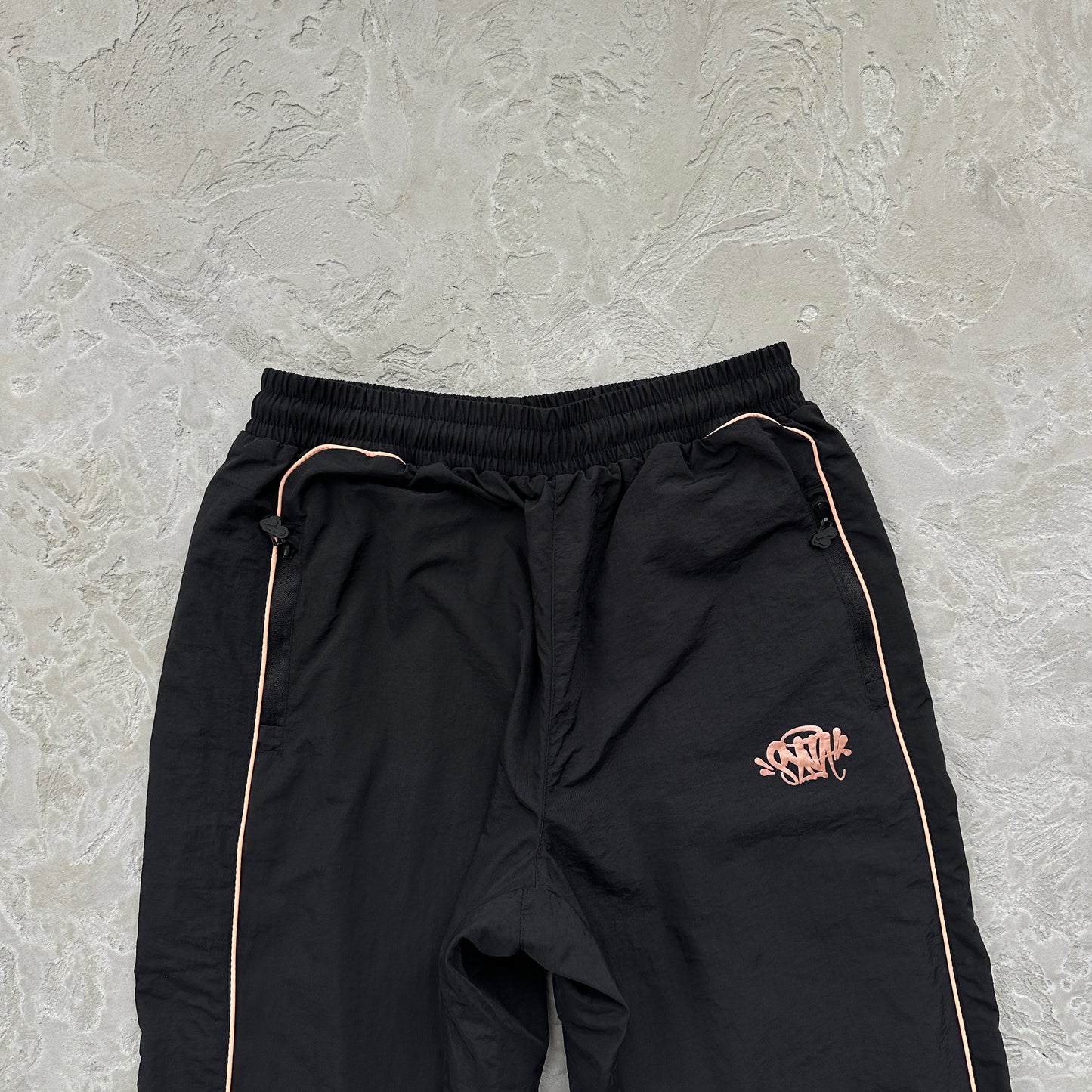 Conjunto Corta Vento SYNA World Preto e Bronze