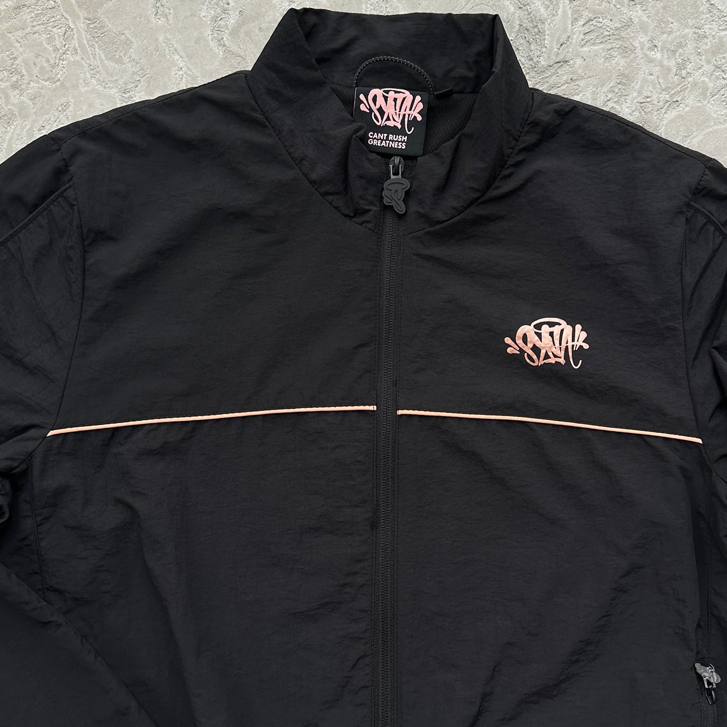 Conjunto Corta Vento SYNA World Preto e Bronze