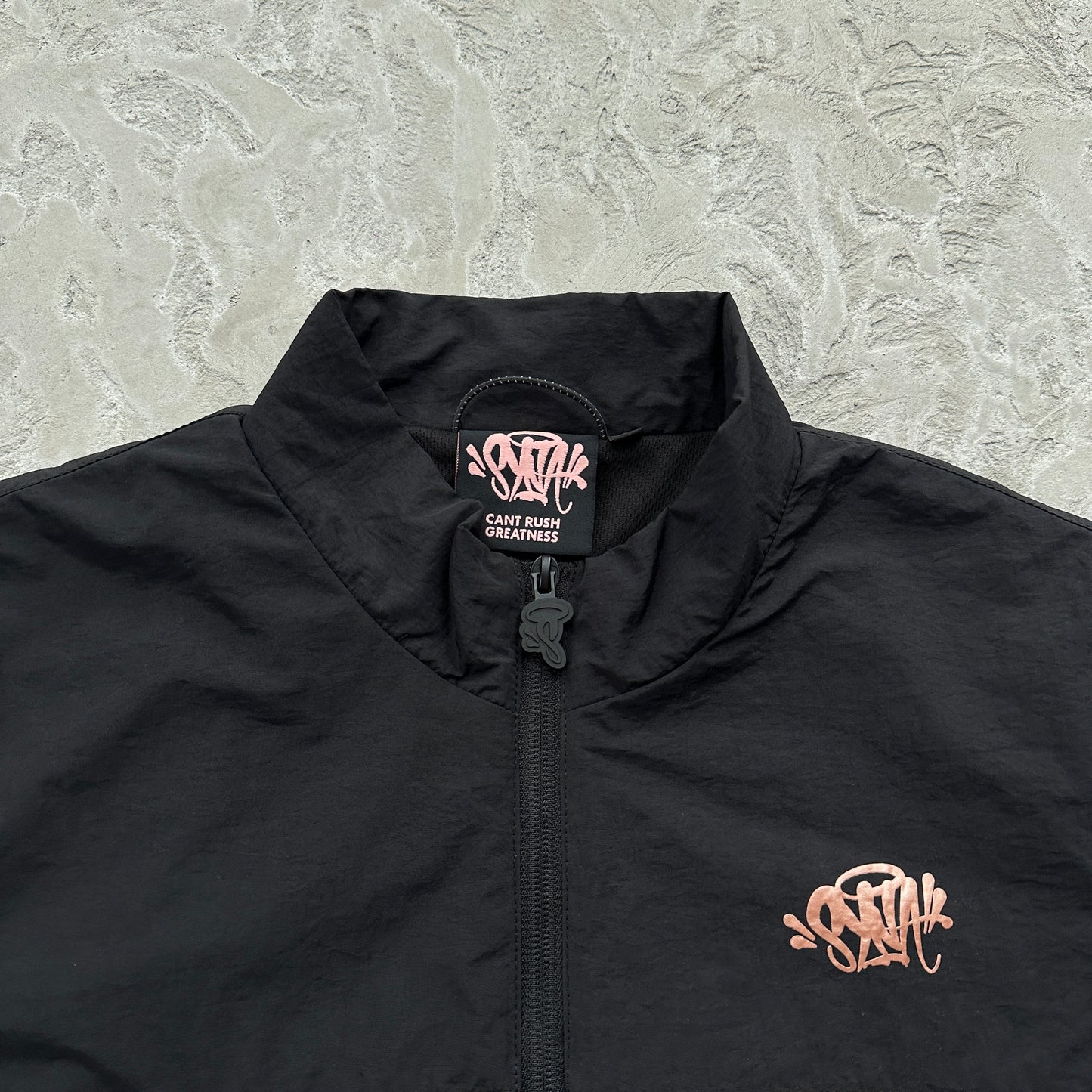 Conjunto Corta Vento SYNA World Preto e Bronze